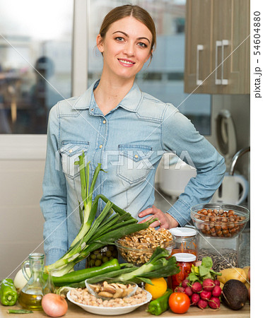 Happy housewife preparing to cooking Happy housewife preparing to cooking 54604880
