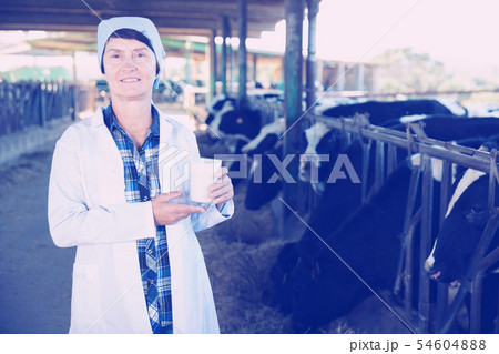 Portrait of woman quality expert who is standing Portrait of woman quality expert who is standing 54604888