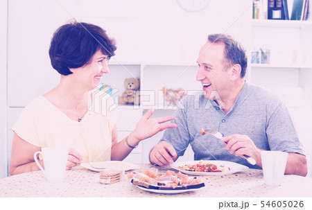 Senior couple having lunch together Senior couple having lunch together 54605026