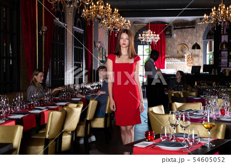 Woman walking in restaurant 54605052