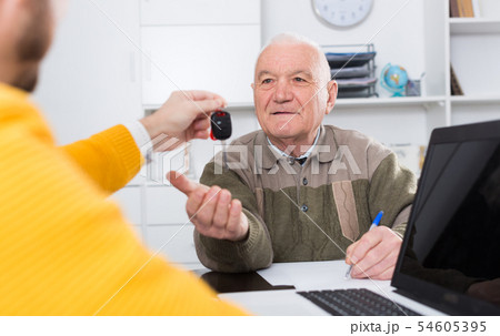 Old man signed car purchase contract Old man signed car purchase contract 54605395