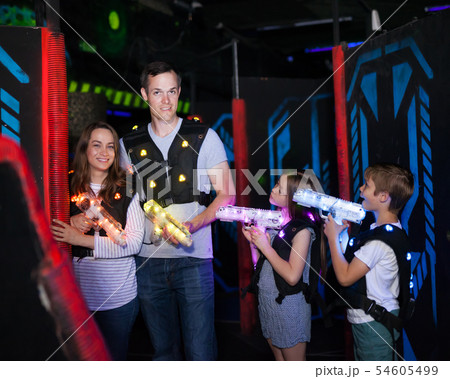 Kids and adults on lasertag arena 54605499