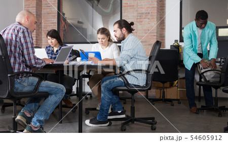 People working in co-working space 54605912