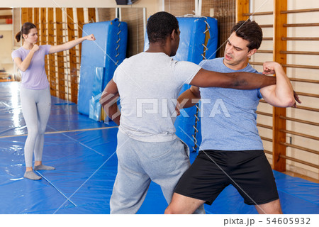 Two men practicing self defense techniques Two men practicing self defense techniques 54605932