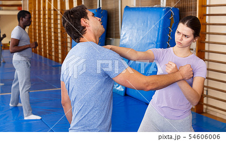 People practicing self defense techniques People practicing self defense techniques 54606006