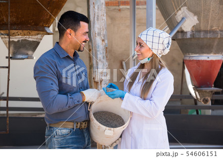 Two farmers in pigsty Two farmers in pigsty 54606151