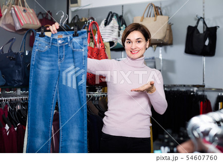 Adult is choosing comfortable jeans Adult is choosing comfortable jeans 54607760