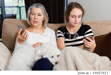 Women using phone at home 54607927