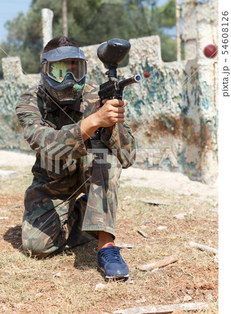 Man playing paintball Man playing paintball 54608126