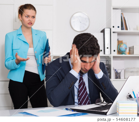 Frustrated businessman with angry chief 54608177