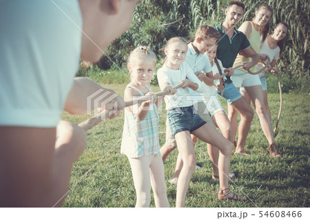 portrait of kids with parents playing active games portrait of kids with parents playing active games 54608466