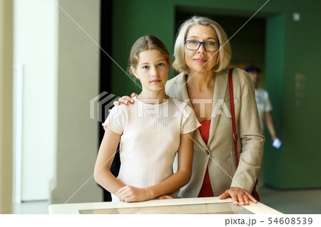 Woman and girl visiting museum Woman and girl visiting museum 54608539