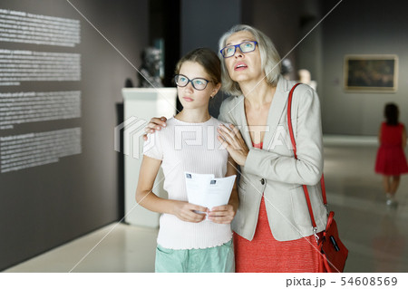 Woman and girl visiting museum Woman and girl visiting museum 54608569