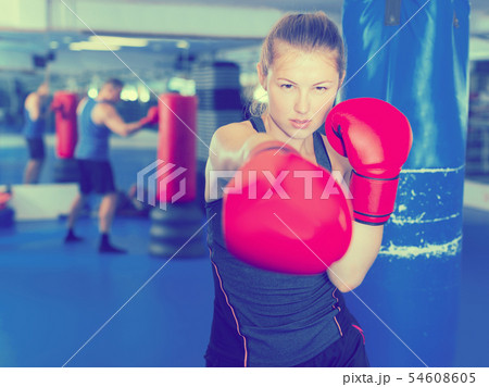 Woman boxing in gym Woman boxing in gym 54608605