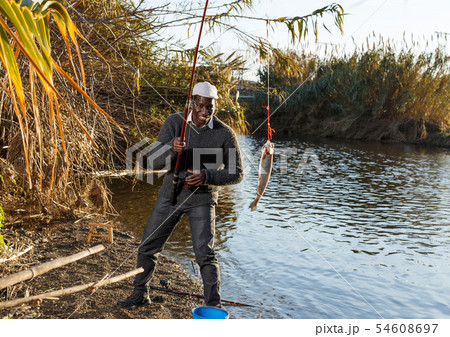 Portrait of enthusiastic African fisherman Portrait of enthusiastic African fisherman 54608697