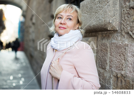 Female in the city in scarf and coat Female in the city in scarf and coat 54608833