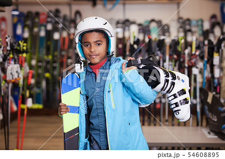 boy posing in full skiing gear during shopping 54608895