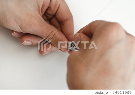 A young man does a manicure. Photo. 54611939