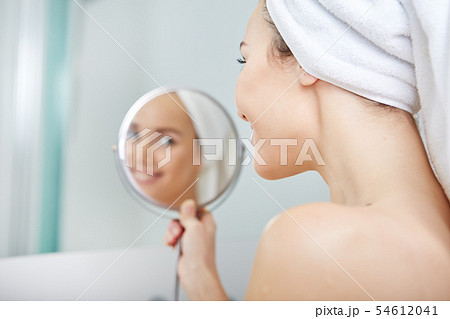 beautiful girl touching her face with a towel on beautiful girl touching her face with a towel on 54612041