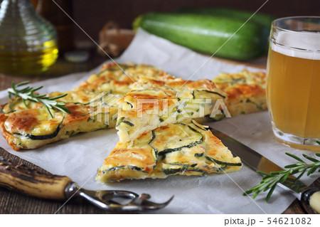 Scarpaccia, Italian food. Thin zucchini pie, beer 54621082