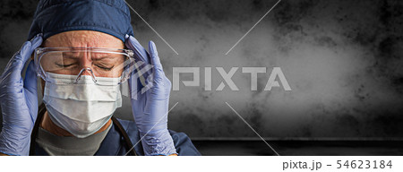 Female Doctor or Nurse in Goggles, Surgical Mask Female Doctor or Nurse in Goggles, Surgical Mask 54623184