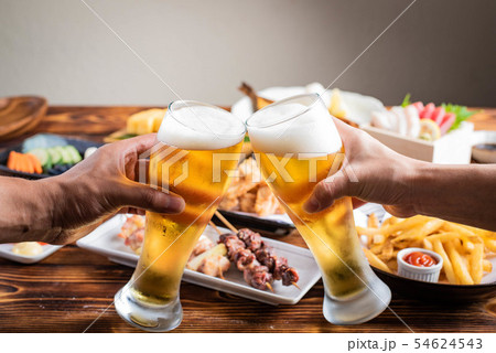 toasting image with beer and japanese izakaya food 54624543