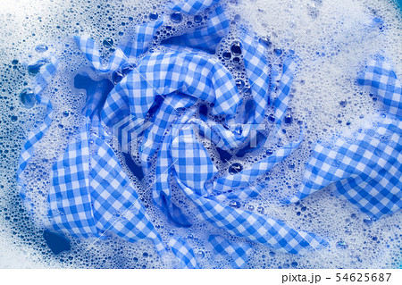 Blue white tablecloth soak in powder detergent Blue white tablecloth soak in powder detergent 54625687