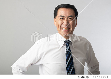 笑顔のビジネスマン 日本人男性 社長 管理職の写真素材