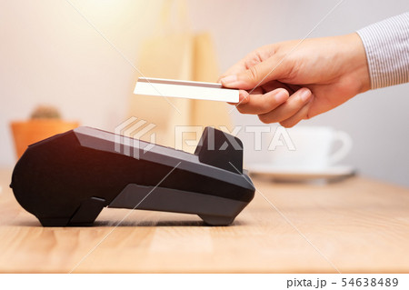 customer using credit cart for payment at POS customer using credit cart for payment at POS 54638489