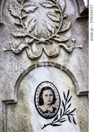 Portrait of the young woman on the old gravestone 54639437