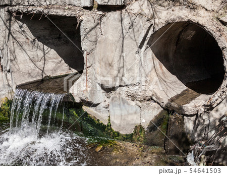 Run-off pipes discharging water Run-off pipes discharging water 54641503