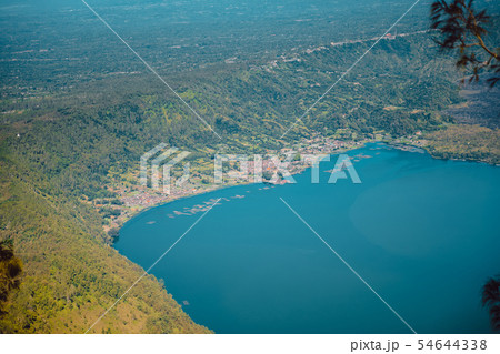 View of Batur volcano and lake with forest in Bali 54644338