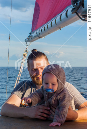 man with a child on a sailing ship 54647914