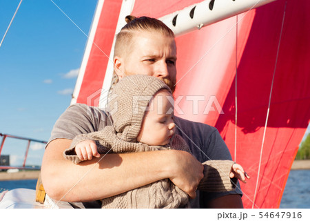 man with a child on a sailing ship man with a child on a sailing ship 54647916