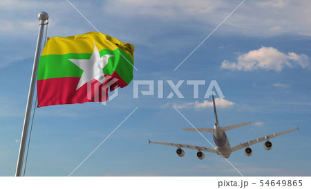 Airplane flying over flag of Myanmar. Myanma tourism related 3D rendering Airplane flying over flag of Myanmar. Myanma tourism related 3D rendering 54649865