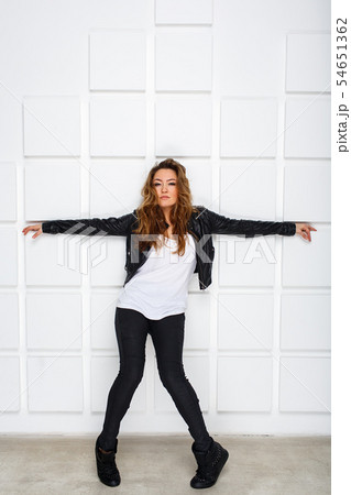 Pretty dancer in black and white clothes dancing 54651362