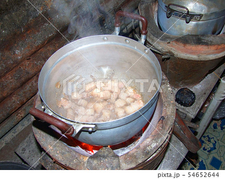 Cooking with pot on charcoal brazier Cooking with pot on charcoal brazier 54652644