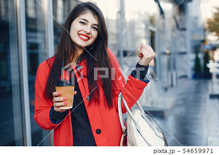 Fashion girl walking in a summer city Fashion girl walking in a summer city 54659971