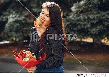 Fashion girl walking in a summer city 54660264