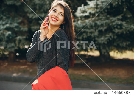 Fashion girl walking in a summer city Fashion girl walking in a summer city 54660303