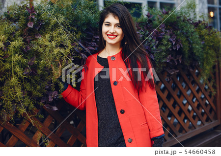 Fashion girl walking in a summer city Fashion girl walking in a summer city 54660458