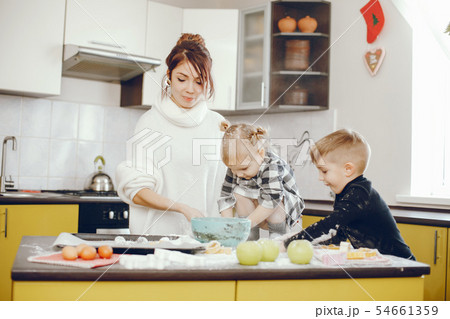 Cute family prepare the breakfest in a kitchen 54661359