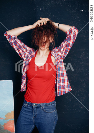 Fashion girl standing in a studio Fashion girl standing in a studio 54661623