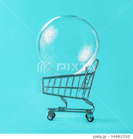 Shopping cart with soap bubble on blue background Shopping cart with soap bubble on blue background 54662550