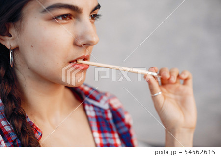 Elegant girl draws in an art studio Elegant girl draws in an art studio 54662615