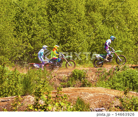 Motocross riders practice tricks on their dirt 54663926