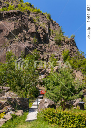 Steep steps leading to the top of a rocky mountain 54664624