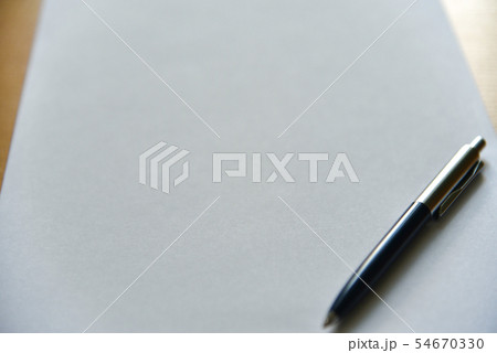 Pen on white paper on the desk in the office 54670330