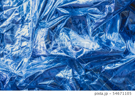 The texture of the crumpled fabric is metallic blue color. 54671105