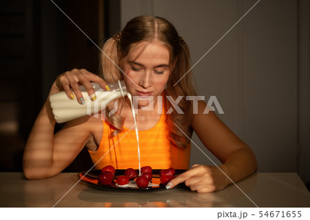 girl eats strawberry 54671655